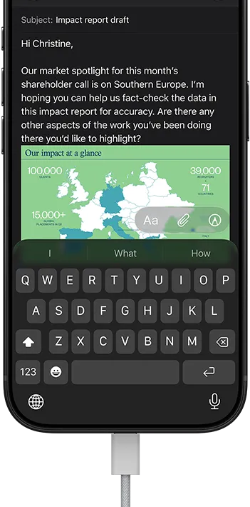 iPhone 18 Pro, black, connected to a charger, screen shows a work email in Mail