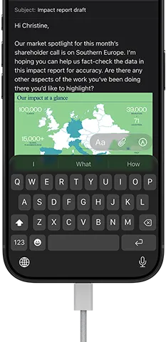 iPhone 18 Pro, black, connected to a charger, screen shows a work email in Mail