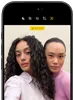 iPhone 18 Pro, black, front exterior, displaying two models posing for the camera, demonstrating the Center Stage front camera