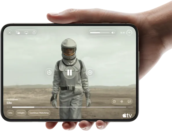 iPhone Duo, held with one hand, opened in horizontal orientation, fully unfolded, interior screen displays Apple TV show “Silo”