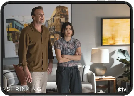 iPhone Duo, opened in horizontal position, Apple TV show “Shrinking” plays on screen